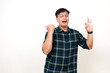 © ArvStd - Wow excited young asian boy making okay gesture while presenting side on empty space