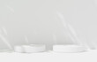 © Kakabe - Cylinder podium leaves natural shadow overlay on studio white background display scene with sunlight. presentation and branding products, Exhibition pedestal , stand, 3d render