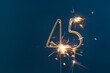45 years celebration festive background made with Bengal fires in the form of number Forty-five.