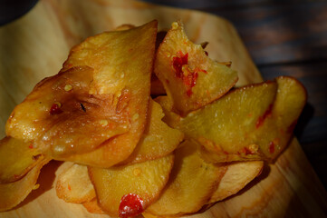 Poster - Keripik Singkong pedas or spicy Cassava Chips, Indonesian traditional snack. Made of cassava sliced, fried and cooked with chilli.