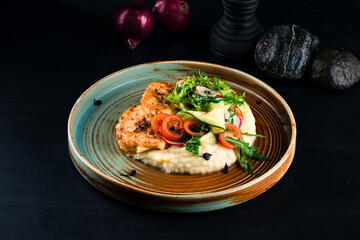 Wall Mural - Fried chicken cutlets with mashed potatoes and fresh vegetable salad.