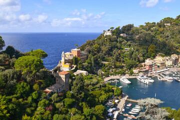 Wall Mural - Elevated view of the famous holiday resort with the small harbour on the Italian Riviera in summer, Portofino, Genoa, Liguria, Italy