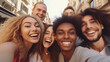© Argun Stock Photos - Group of young multiethnic people taking selfie on the street.