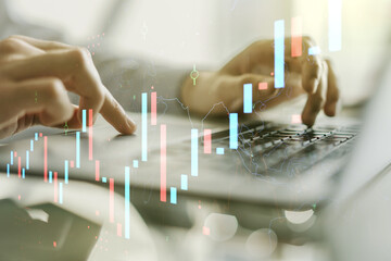 Poster - Multi exposure of abstract financial graph with hand typing on laptop on background, financial and trading concept