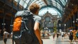 Traveler Exploring Historic Train Station, Backpack Adventure