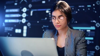 smart young woman programmer working with computer in modern office of digital company, portrait