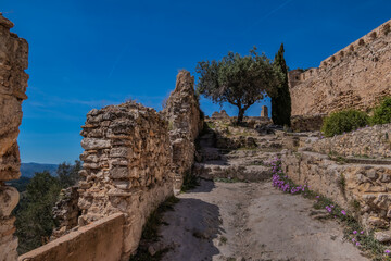 Wall Mural - Xativa Castle or Castillo de Xativa - ancient fortification on the ancient roadway Via Augusta in Spain. Medieval ruins of the walls of Xativa castle. Xativa, Spain, Europe.