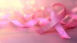 Breast cancer awareness symbol with pink ribbon on magical blurred pink background and copy space