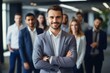© Thanaphon - Portrait of people, businessman smiling happily and team in the background inside modern office.