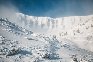 Sticker - Snow-white slopes of the highlands in sunny and frosty weather.