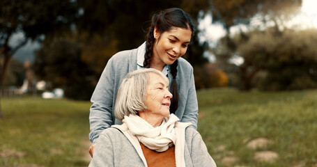 Wall Mural - Senior woman, talking and outdoor with caregiver, nurse or healthcare service for person with a disability and wheelchair. Happy, face and elderly lady in park with care and support in retirement