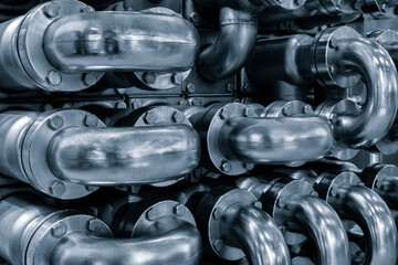 Poster - Metal blue curved pipes as an industrial concept background for a web page, template or web banner