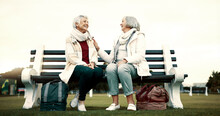 Women, Bench Or Old People Talking In Park Or Nature Speaking Or Bonding Together In Retirement Outdoors. Senior, Elderly Or Mature Woman In Conversation To Relax With Peace Or Care On Holiday Break