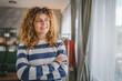 © Miljan Živković - Portrait of adult caucasian woman with curly hair at home happy smile