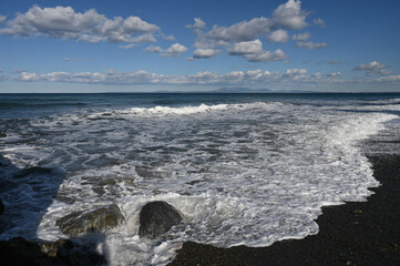 Wall Mural - waves on the beach near a restaurant on the Mediterranean coast 6