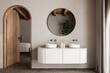 © leymandesign - Beige bathroom interior with double sink and mirror, carpet on hardwood floor, bathtub, plants. Bathing accessories and window in hotel studio, arches.