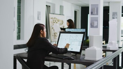 Poster - Asian graphic artist designing floor plan blueprint using modern architectural software, drawing scale elements and outlines to measure property. Small business employee, coworking space.
