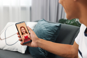 Sticker - Long distance love. Man having video chat with his girlfriend via smartphone at home, closeup