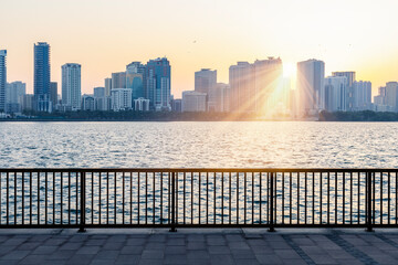 Wall Mural - Beautiful view of waterfront cityscape with skyscrapers of the Emirate of Sharjah in the United Arab Emirates. Concept of tourism in UAE.