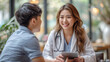 © aekkorn - Female doctor and young male patient while consult and explain. Doctor and patient sitting together at table in examination room.