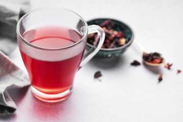 Wall Mural - Glass cup of hot hibiscus tea.