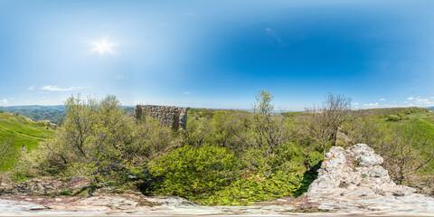 Wall Mural - Wide panoramic view on mountain landscape with lush green hills under clear blue sky, tranquil natural beauty, perfect for outdoor enthusiasts. Seamless 360 degree spherical equirectangular panorama.