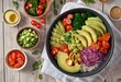© Алексей Ковалев - Healthy salad bowl with quinoa, tomatoes, chicken, avocado, lime and mixed greens, lettuce, parsley on wooden background top view. Food and health.