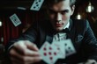 Male model in a close-up, perfecting a complex magic trick with cards