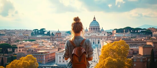 Wall Mural - Young traveler woman exploring city famous landmarks. Back view of female tourist enjoying historic on sunny vacation day in urban. Caucasian woman touring culture and religion in beautiful cityscape