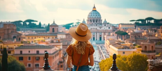 Wall Mural - Young traveler woman exploring city famous landmarks. Back view of female tourist enjoying historic on sunny vacation day in urban. Caucasian woman touring culture and religion in beautiful cityscape