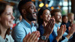 © MP Studio - Group of people applauding in a business or formal setting.