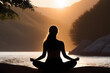 © D - silhouette of a person meditating on the beach.