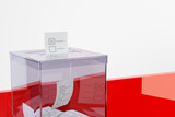 Fototapeta  - Transparent ballot box on a white-red background, 3D illustration