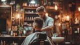 Young handsome Barber gives a haircut to a brutal man in a barbershop