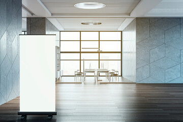 Poster - Contemporary spacious coworking office room interior with empty white mock up roll up banner and various objects. 3D Rendering.