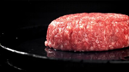 Sticker - A fresh meat burger falls on a black table. Filmed on a high-speed camera at 1000 fps. High quality FullHD footage