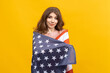 © makedonski2015 - The striking contrast between the American flag and the yellow background in this photo is truly captivating. The woman's captivating gaze makes it hard to look away