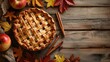 Apple pie within a festive autumn holiday setting, cinnamon sticks, maple leaves on wooden background