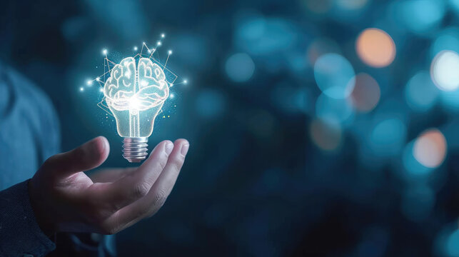 Businessman holding half of the virtual lightbulb and brain on blue bokeh background, Smart thinking idea and inspiration innovation concept 