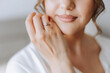 © Vasil - tender hands of a young woman with an expensive ring and a beautiful manicure. Close-up photo of female hands