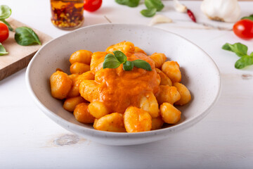 Wall Mural - Potato gnocchi with fresh tomatoes sauce. Typical Italian food.