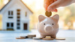 Piggy bank on house background. Focus on piggybank. Homeowner. Real estate sale, home savings, loans market concept. Housing industry mortgage plan and residential tax saving strategy.