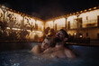 © Halfpoint - Beautiful mature couple relaxing in outdoor hot tub, enjoying romantic wellness weekend in spa. Concept of Valentine's Day.