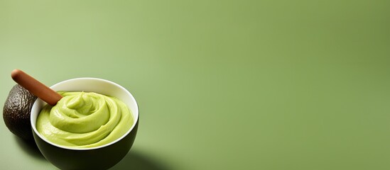 Poster - Fresh avocado puree in a small bowl and wooden hairbrush Homemade face or hair mask natural beauty treatment and spa recipe Top view copy space. Creative Banner. Copyspace image