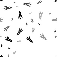 Poster - Seamless vector pattern with rockets, creating a creative monochrome background with rotated elements. Vector illustration on white background