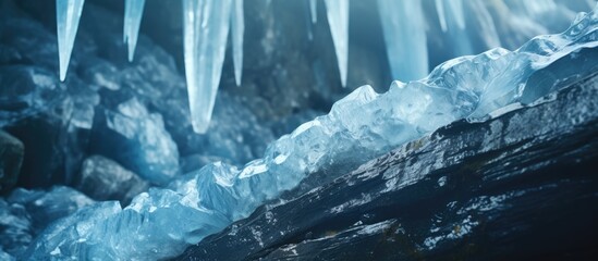 Fototapete - Frozen waterfall of blue icicles on the rock. Creative Banner. Copyspace image