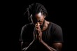 Black History Month, african american man praying on black background, praying to god with religious