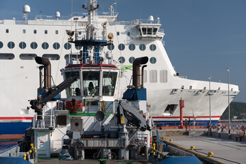 Poster - TUG AND PASSENGER FERRY - White ship sails from the port to  sea
