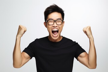 Poster - A man with glasses and a black shirt raising his fists. Perfect for expressing determination and strength
