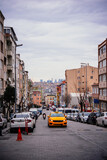 Fototapeta  - Taxi rides in a residential part of Fatih district in Istanbul, Turkey.